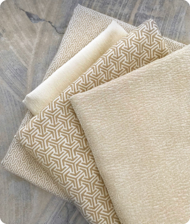 A jute rug with a geometric pattern lies on a wooden floor.